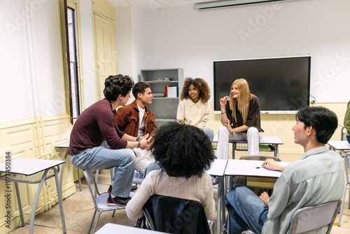 Diverse high school or college students sitting in a circle in a classroom, actively listening and discussing during a group activity