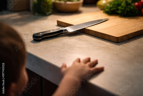 Baby Hand Reaching Toward Knife on Counter