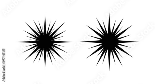 Two black starburst shapes with sharp radiating spikes against a white background