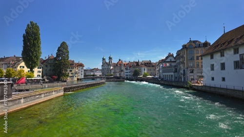 Lucerne riverfront with urban scenic view, highlighting popular Swiss travel destination and beautiful city landscape