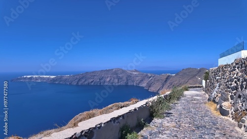 Rugged volcanic cliffs of Santorini, Greece along the Aegean Sea, showcasing dramatic coastal landscape and iconic travel destination scenery