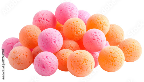A pile of colorful, spherical foam, ranging from pink to orange, against a black backdrop