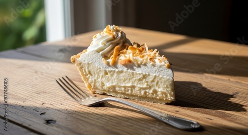 Slice of Creamy Pie with Toasted Topping and Fork on Wooden Table.
