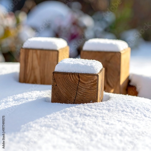 Wooden blocks dusted with snow in a bright winter outdoor scene