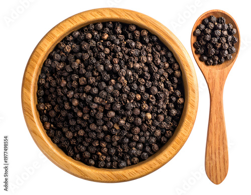 Overhead view of dark, round peppercorns in wooden bowl and spoon