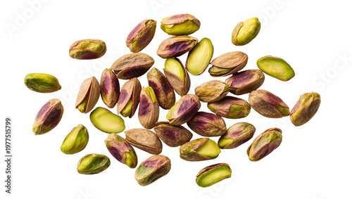 Cuadro en lienzo Scattered shelled pistachios with purple skin and green kernels, isolated on tra