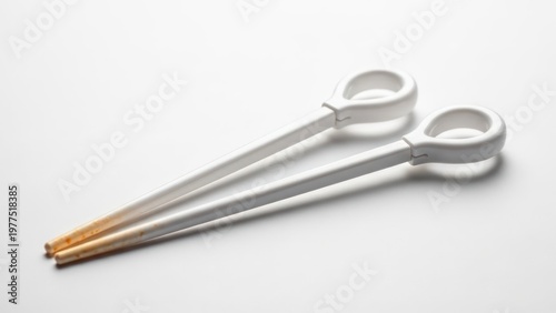 Wallpaper Mural White plastic tongs on white background Torontodigital.ca