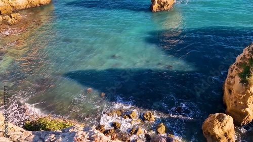 Portugal Algarve 4K Photo of Praia da Marinha Iconic Double Arch in Shape of M with Orange Cliffs and Turquoise Sea Scenic Atlantic Coastline Most Beautiful Beach Travel
