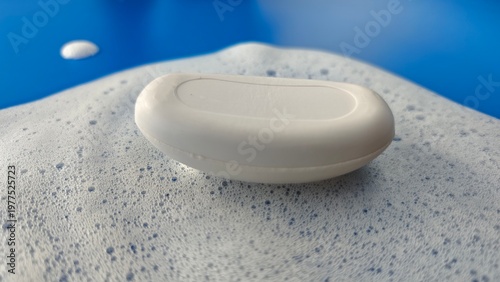 Bild auf Leinwand Soap resting on a bubble foam surface during a cleaning routine at home
