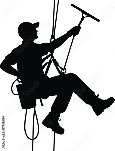 Foto Window cleaner silhouette working at height, rope access technician cleaning gl