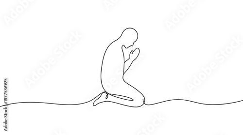 Man kneeling in prayer with hands clasped in a moment of deep contemplation and spiritual connection