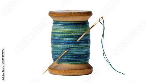 Εκτύπωση καμβά Isolated wooden spool of vibrant blue and green multicolored thread with a shiny