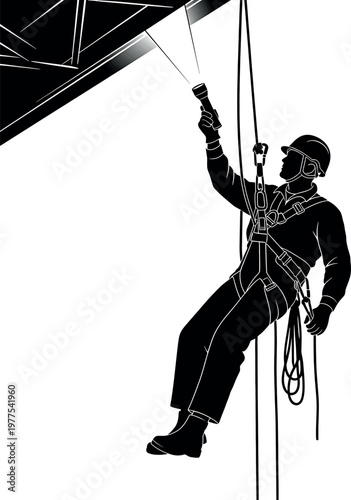 Silhouette of a window washer rappelling down a high rise building showcasing urban cleaning and safety measures