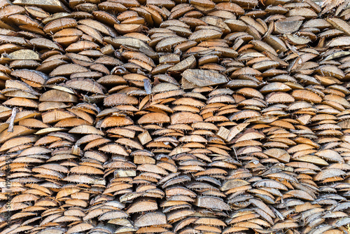 Stacked wooden slices arranged in a textured pattern for background