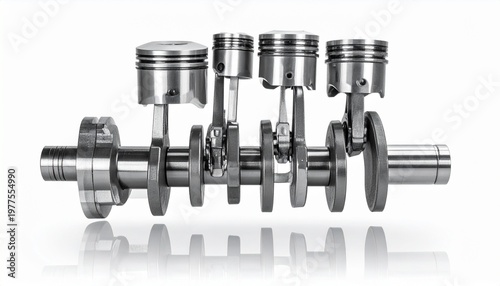 An internal combustion engine crankshaft with four pistons attached to connecting rods. The assembly showcases precision engineering, metal components, the mechanical system, and rotational power.