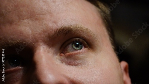 Close-up of a man's eye with a focused gaze