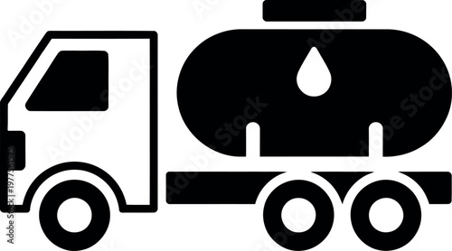 Truck hauling a large fuel tanker trailer on a road