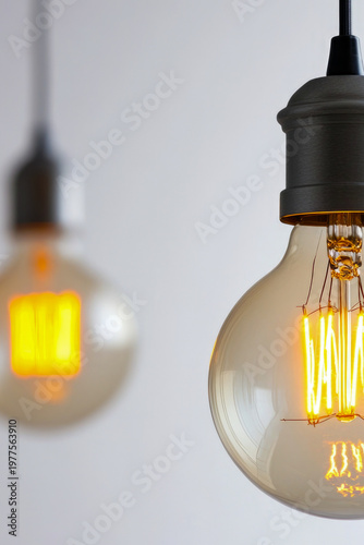 A cluster of light bulbs suspended from the ceiling, providing soft ambient lighting. vertical frame