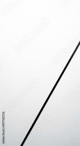 Minimalist abstract art featuring a stark black line against a pristine white surface, emphasizing purity and reductive design, form, art, line