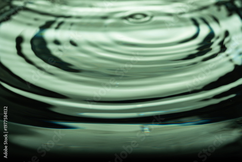 351.Green-Tinted Ripples from Central Water Disturbance