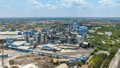 Bild auf Leinwand Cement factory aerial view with silos kilns and conveyor systems in industrial l