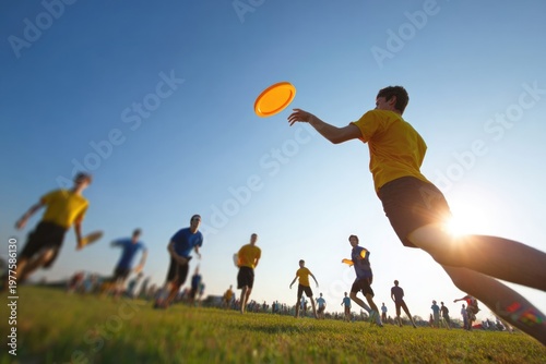 Male ultimate frisbee player throwing disc at sunset