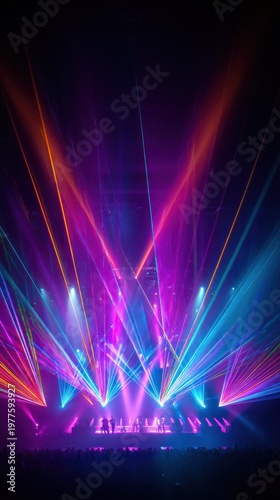 Dynamic stage lighting with colorful beams creating a vibrant atmosphere