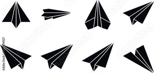 Collection of Black Paper Airplanes in Various Orientations and Angles on White Background origami flight