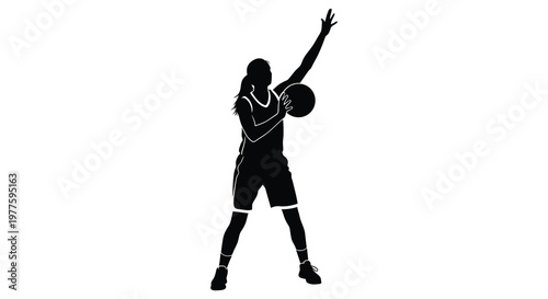 A basketball player in mid shot arm raised shown in black silhouette