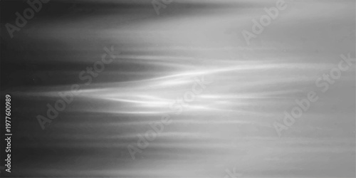 A polished silver stainless steel plate with a brushed metal texture creates a sleek metallic pattern on a smooth gray aluminum surface for a shiny industrial backdrop design