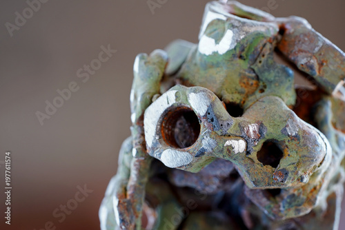 Tableau sur toile Abstract Industrial Sculpture Made of Welded Rusty Nuts and Scrap Metal with Gri