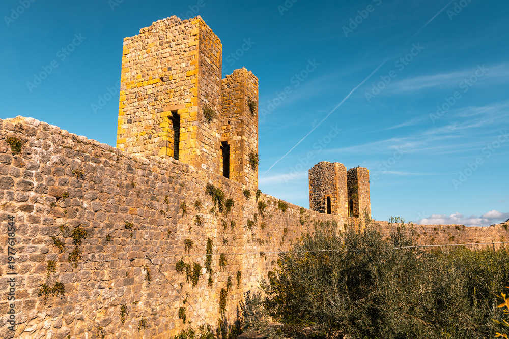 Fototapeta premium Monteriggioni medieval city walls under clear sky, Italy.
