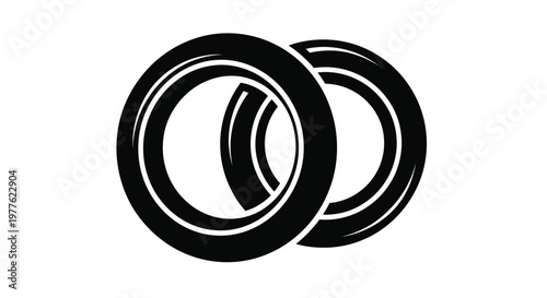Two black tires stacked against a white background a bold silhouette