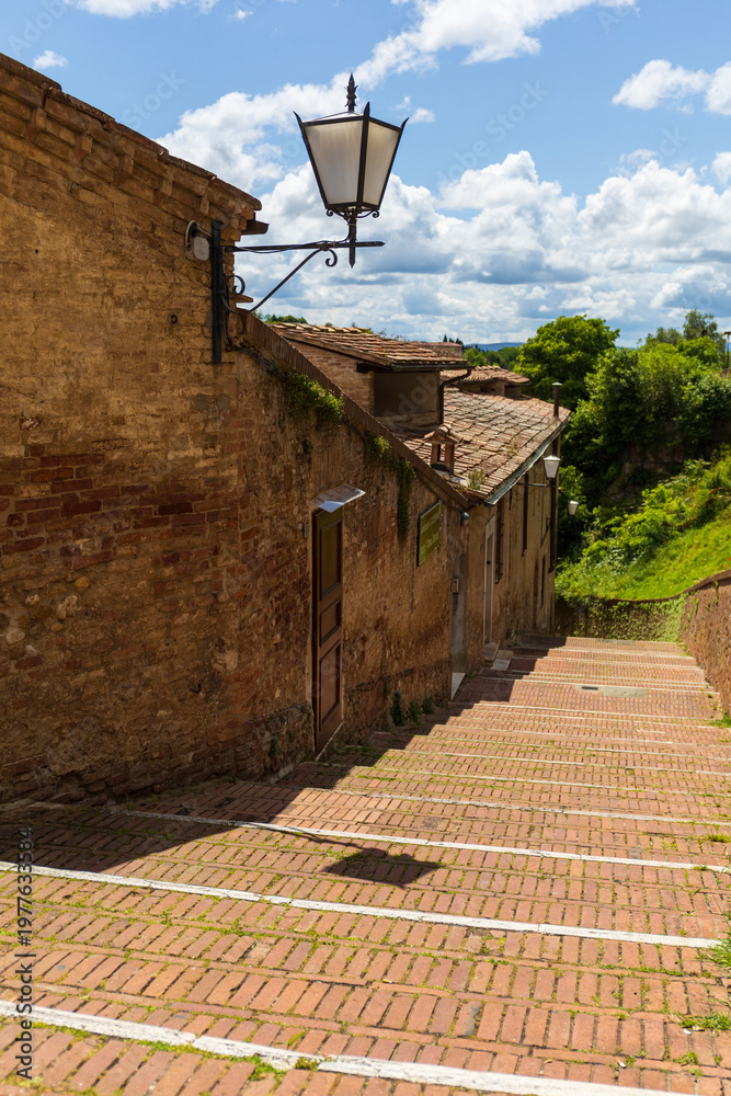 Fototapeta premium Historic Brick Street in Siena, Italy