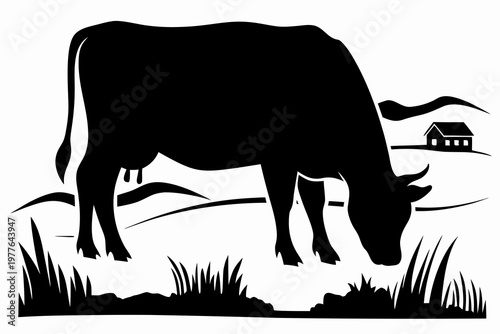 Black silhouette of a cow grazing in a rural landscape with a house