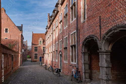 Εκτύπωση καμβά Historic brick houses and cobblestone street in Groot Begijnhof - Leuven, Belgiu