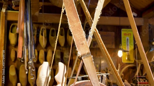 Clogs making. A clog maker also called wooden shoes in holland is engraving original dutch clogs, this craft can be seen at the cheese market