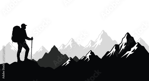 A lone hiker stands overlooking majestic mountains a striking black silhouette