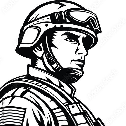 Determined American soldier portrait wearing helmet and goggles looking sideways with strong resolve