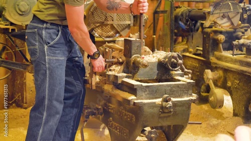 Clogs making. A clog maker also called wooden shoes in holland is engraving original dutch clogs, this craft can be seen at the cheese market