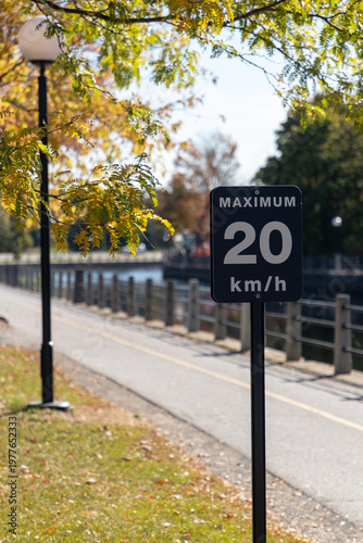 Maximum 20 km h speed limit sign on Rideau Canal pathway in Ottawa, Canada