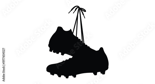 A black soccer cleat with untied laces is shown in dark silhouette
