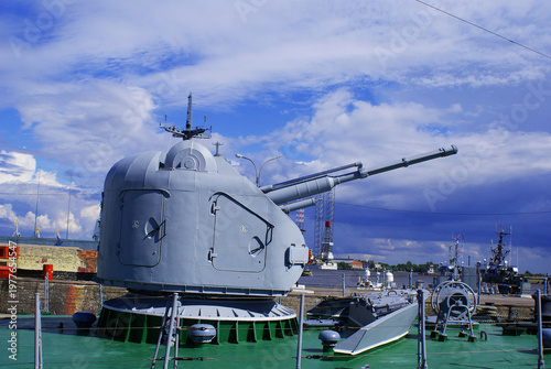 Konstfotografi A warship moored on the embankment in the city center, navy, naval artillery, military weapons