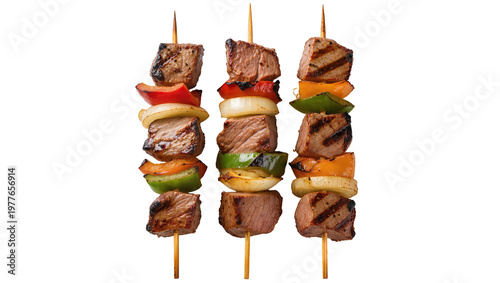 Photos Three grilled beef skewers with bell peppers and onions, isolated on transparent