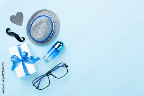 Happy Father's Day accessories on color background, top view