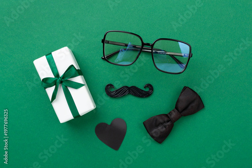 Happy Father's Day accessories on color background, top view