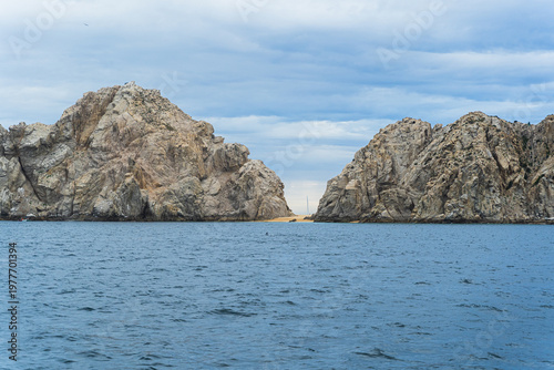 Beautiful isle at Cabo St. Lucas, Mexico with ocean as foreground and cloud as background. Landscape photography