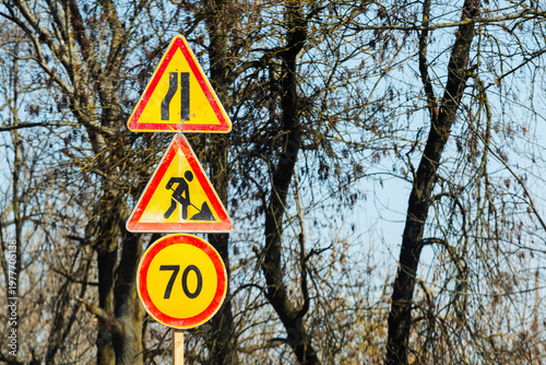 Warning temporary road signs on the road.