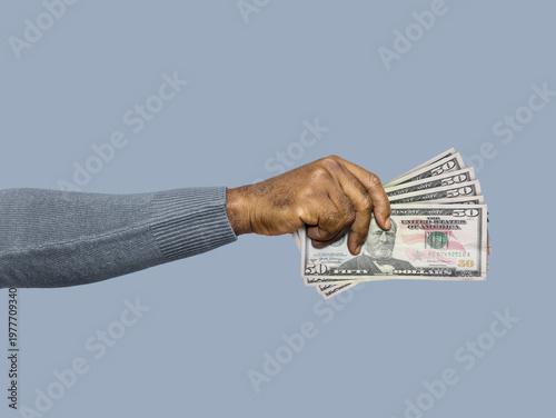 A hand holds a fanned stack of US $50 bills against a neutral background. This clean stock photo symbolizes wealth, cash payments, banking, financial growth, and consumer spending power.