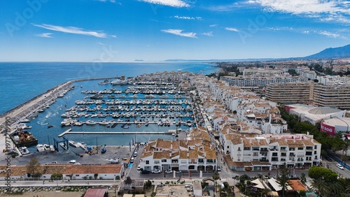 Puerto Banús marina aerial view, Marbella coastal harbor and beach, Costa del Sol, Spain drone panorama